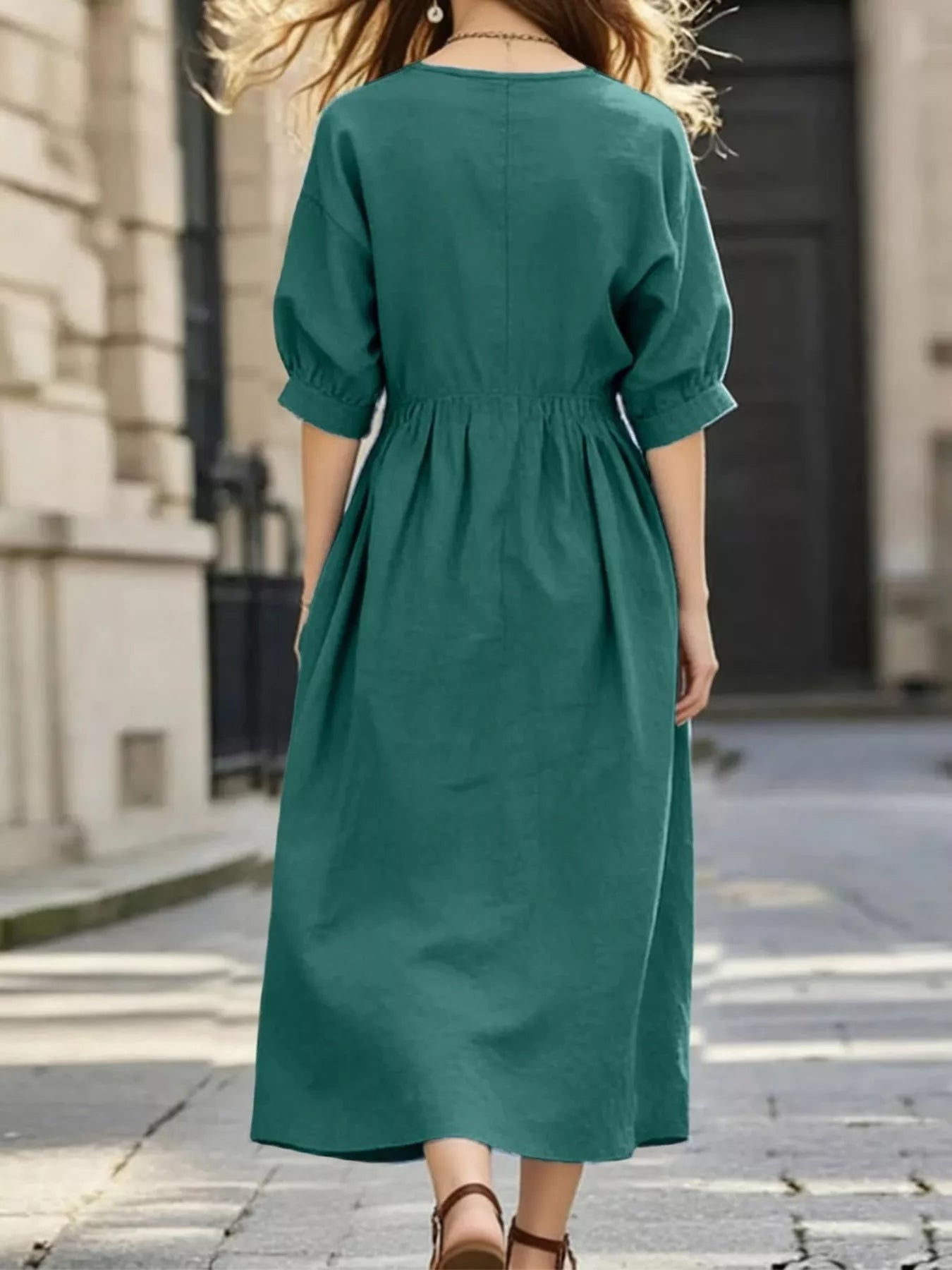 Green back view notched V-neck midi dress with half sleeves and gathered waist