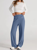 Dusty blue high-waist wide-leg pants with front button detail and large pockets
