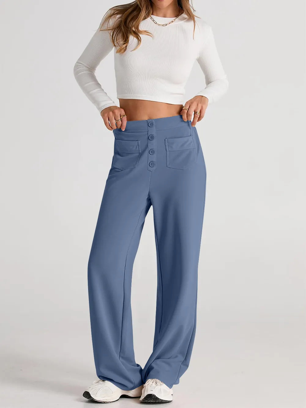 Dusty blue high-waist wide-leg pants with front button detail and large pockets