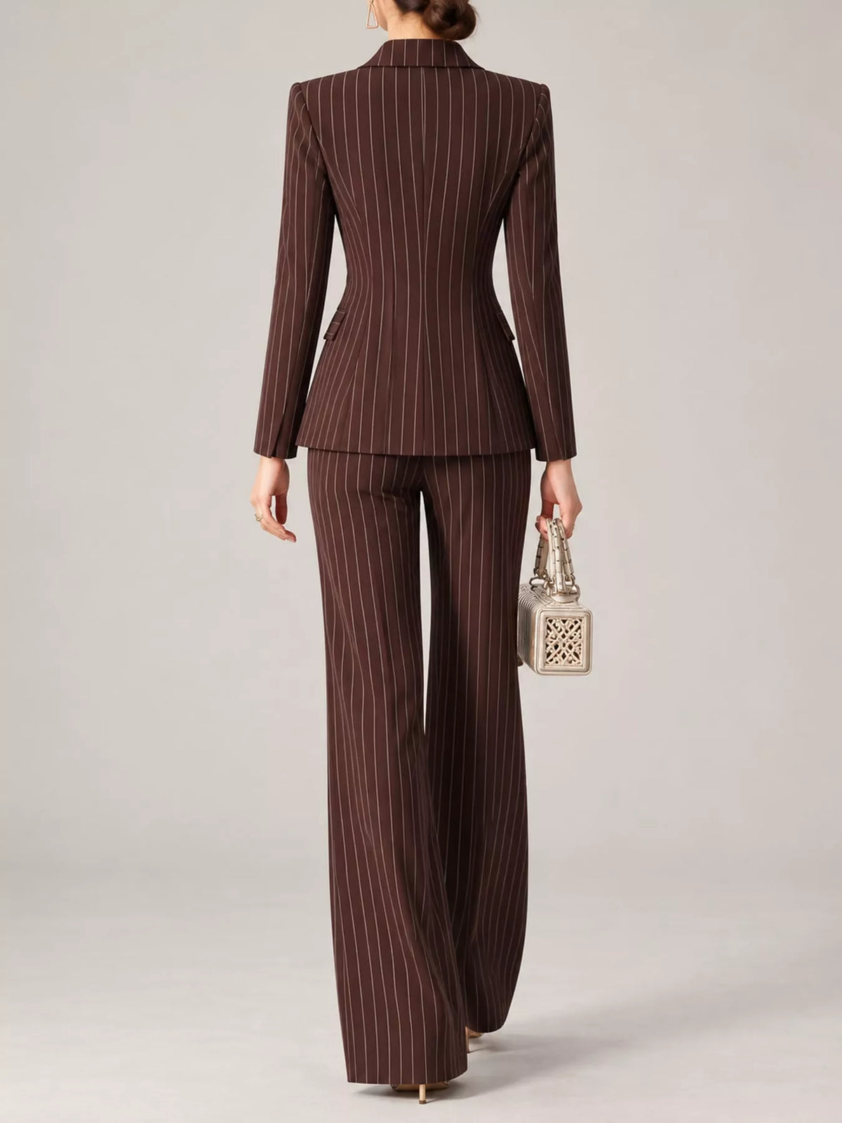 Back view of dark plum-brown pinstripe blazer and wide-leg pants set.
