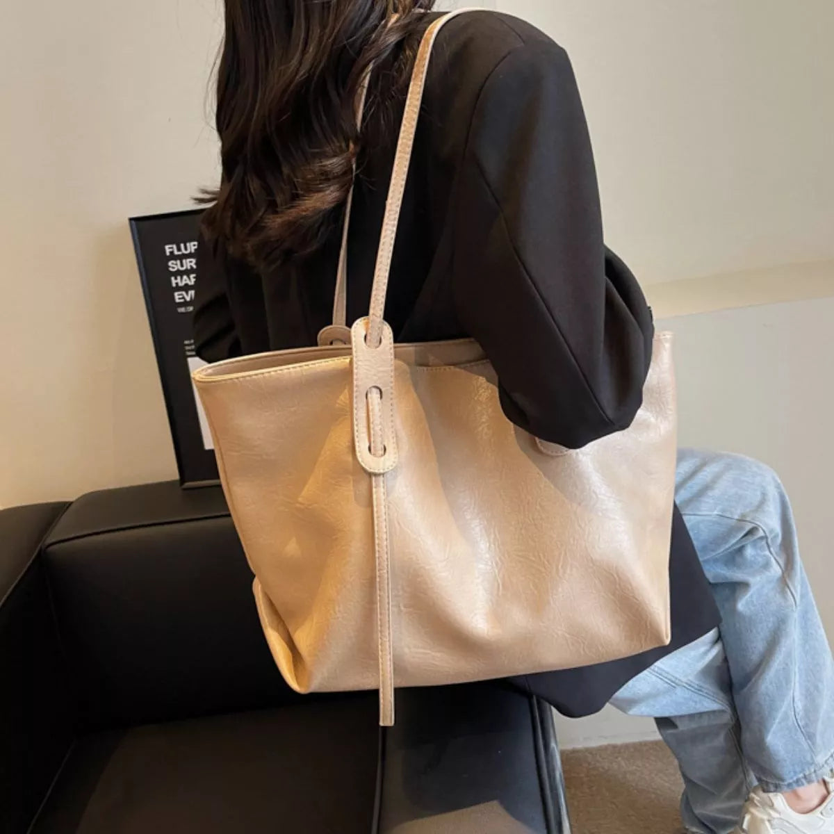 Khaki vegan leather tote bag with adjustable shoulder strap and long front pull tab