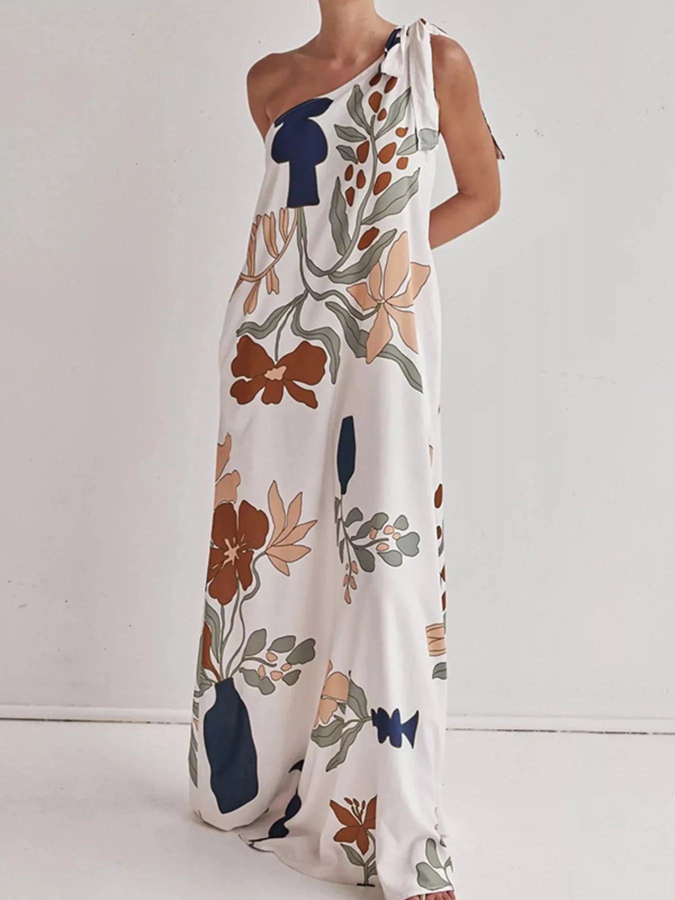 Cedar & Moore Bohemian Floral Print One-Shoulder Maxi Dress in white with orange, navy and sage botanical motifs