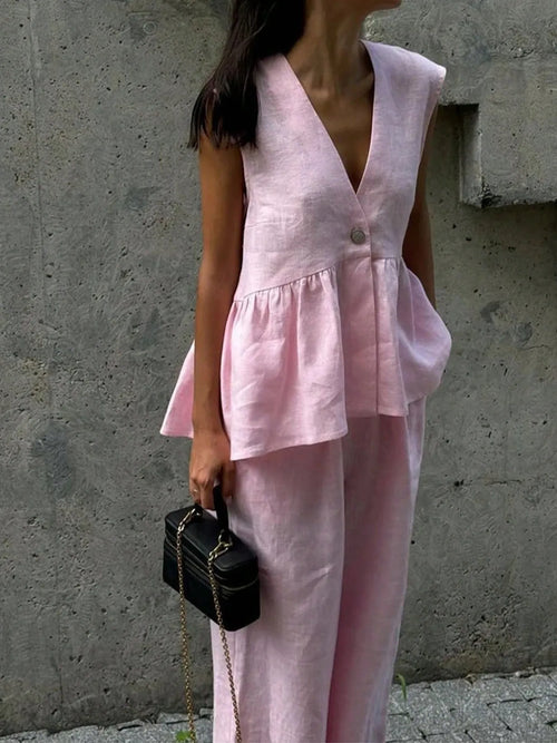 Blush pink button-front peplum vest and matching pants set, sleeveless V-neck