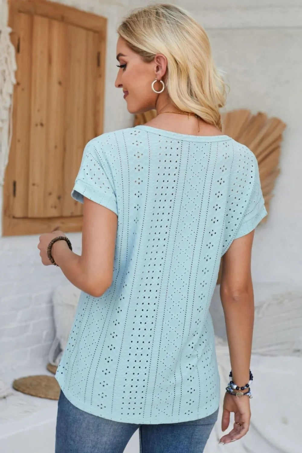 Light blue eyelet short-sleeve T-shirt with round neck, back view