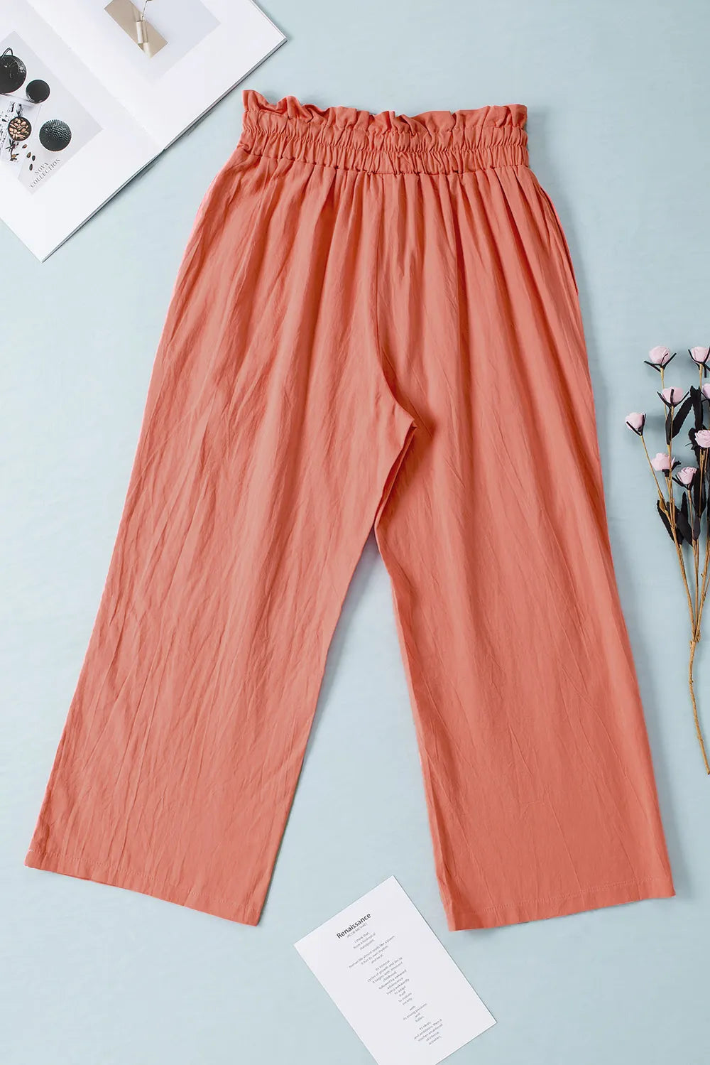 Coral drawstring paperbag waist wide-leg pants, pleated front and elasticized waistband.