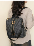 Geometric pattern backpack bag in dark gray/black, front zip pocket, gold-tone hardware