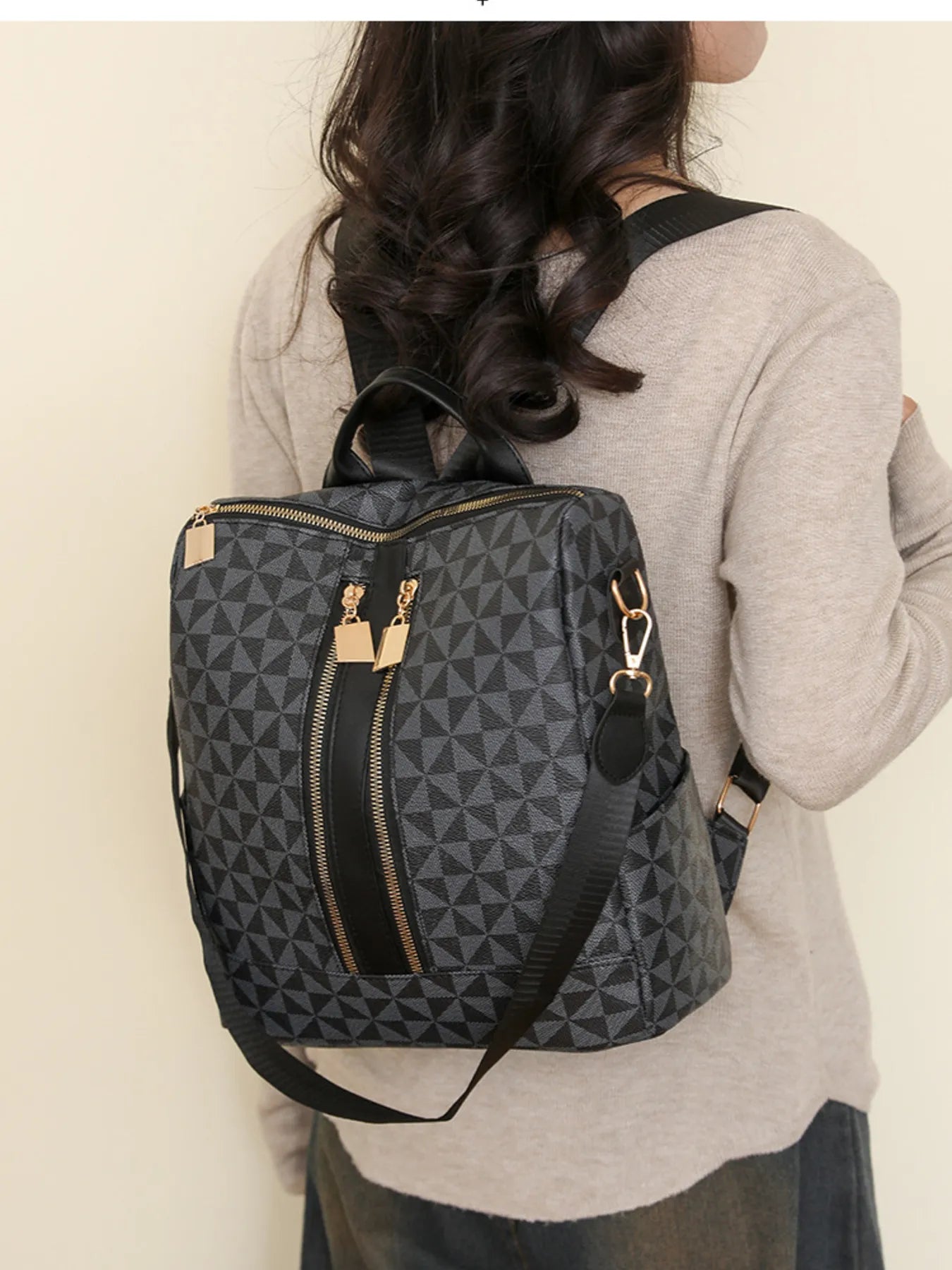 Geometric pattern backpack bag in dark gray/black, front zip pocket, gold-tone hardware