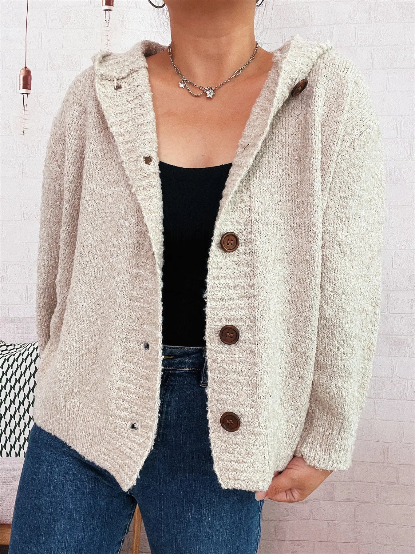 Cozy hooded cardigan, cream textured knit with dark brown buttons.