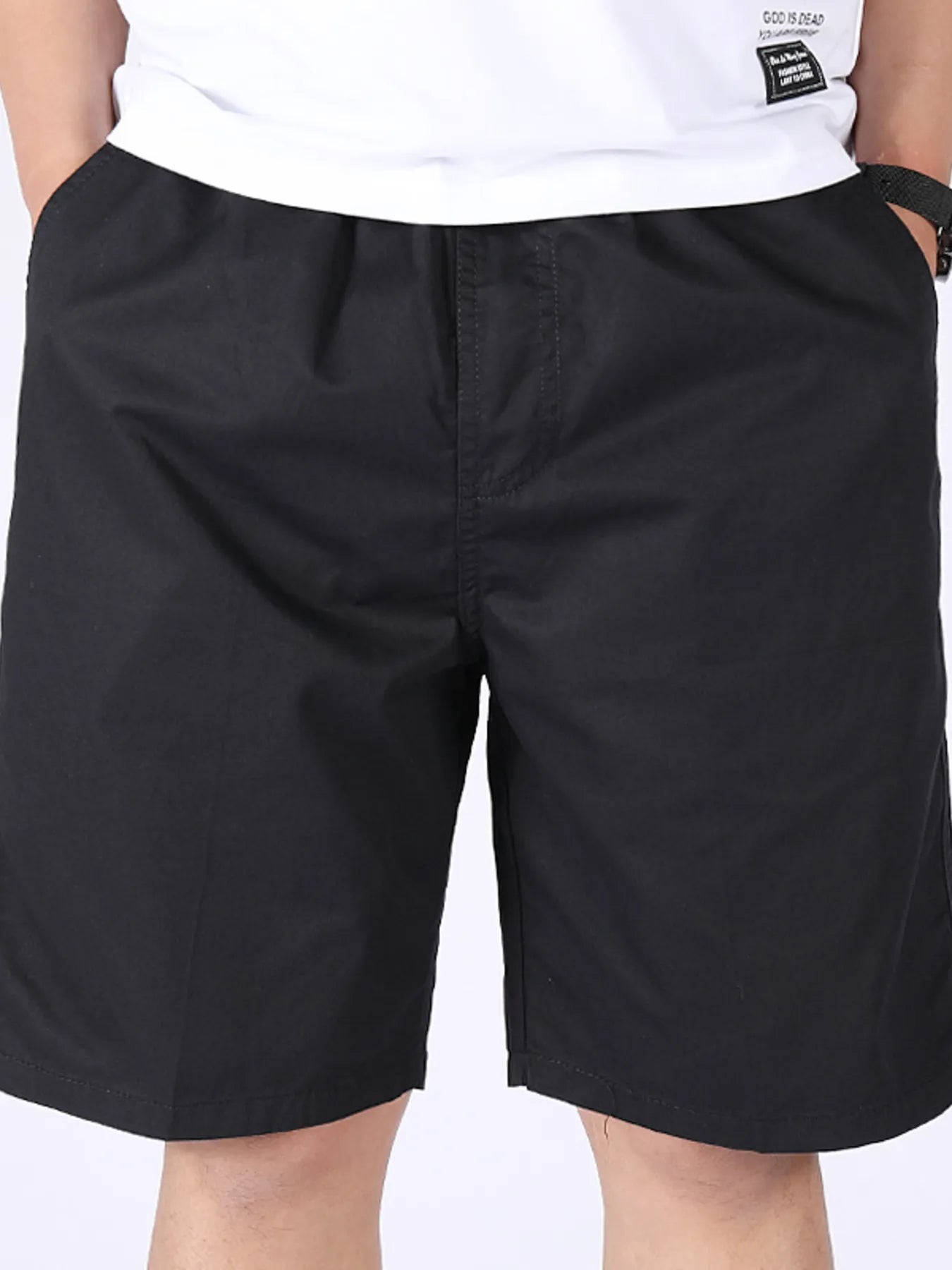 Men's plus-size black pocketed shorts with zip fly, belt loops, and side pockets