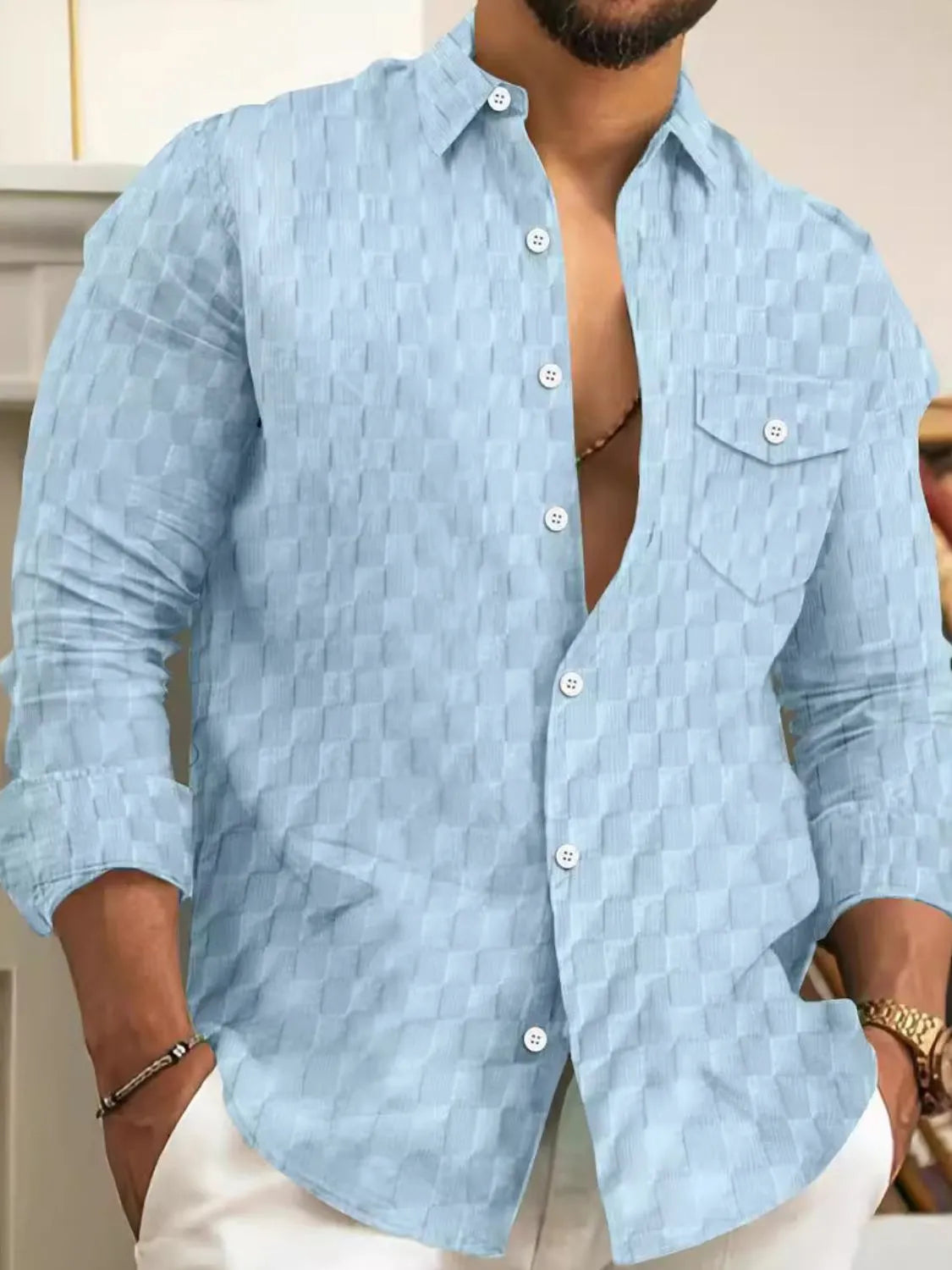 Men's button-up long-sleeve shirt, textured light blue with chest pocket and button placket