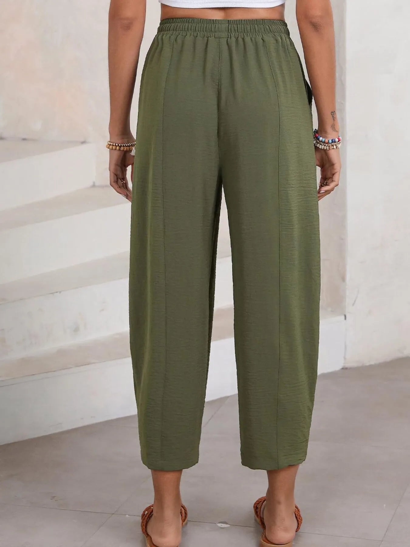 Olive green cropped wide-leg pants with drawstring elastic waistband