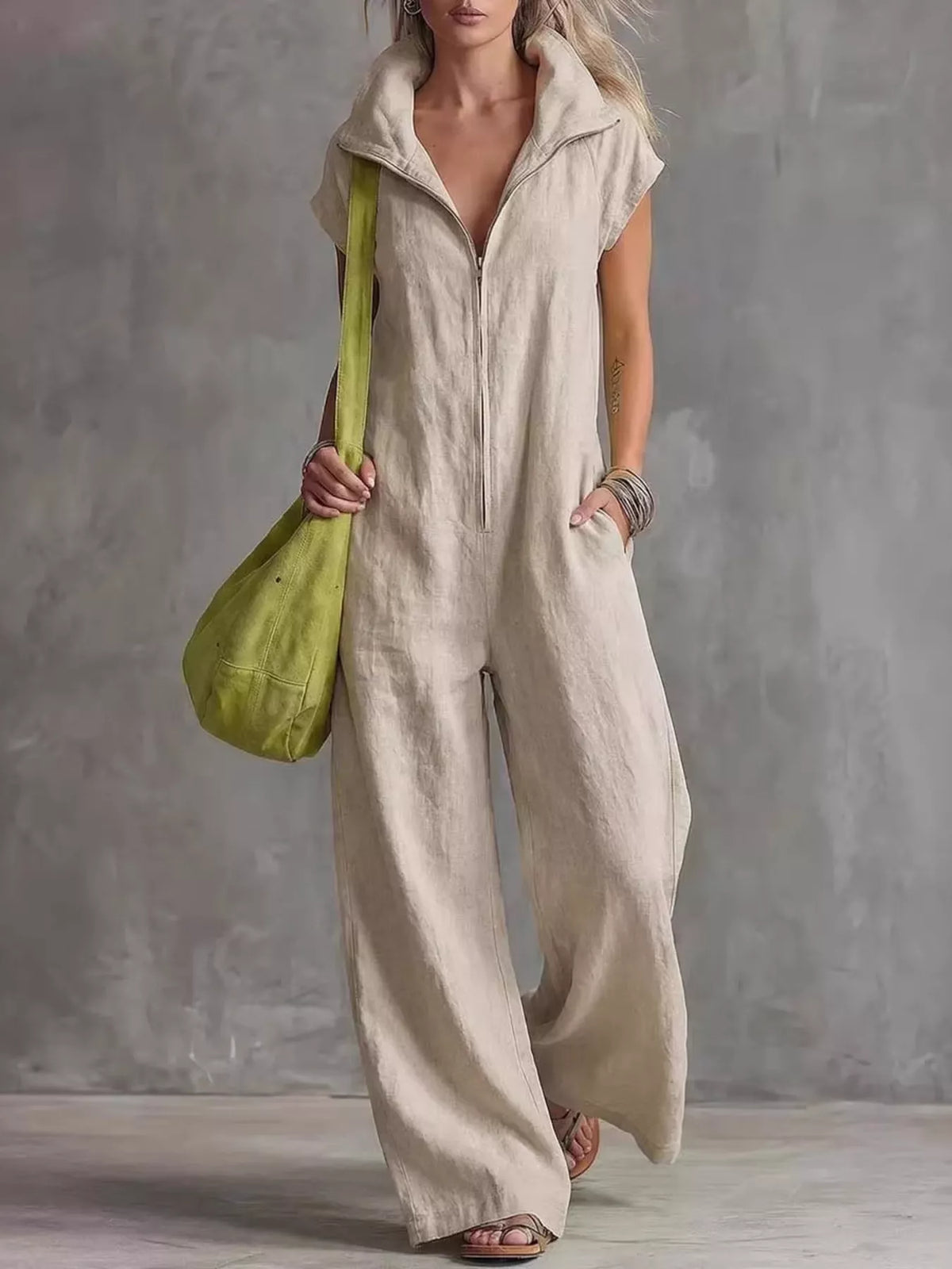 Apricot sleeveless zip-front pocketed women’s jumpsuit with collared neckline and wide legs