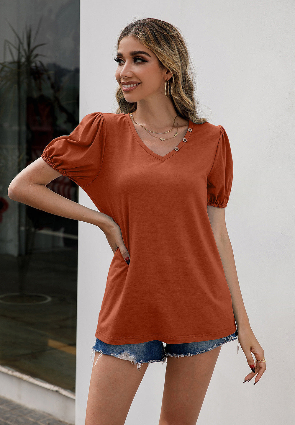 Cedar & Moore Ivy Lane V-Neck Decorative Buttons Puff Sleeve Tee in rust-orange with short puff sleeves.