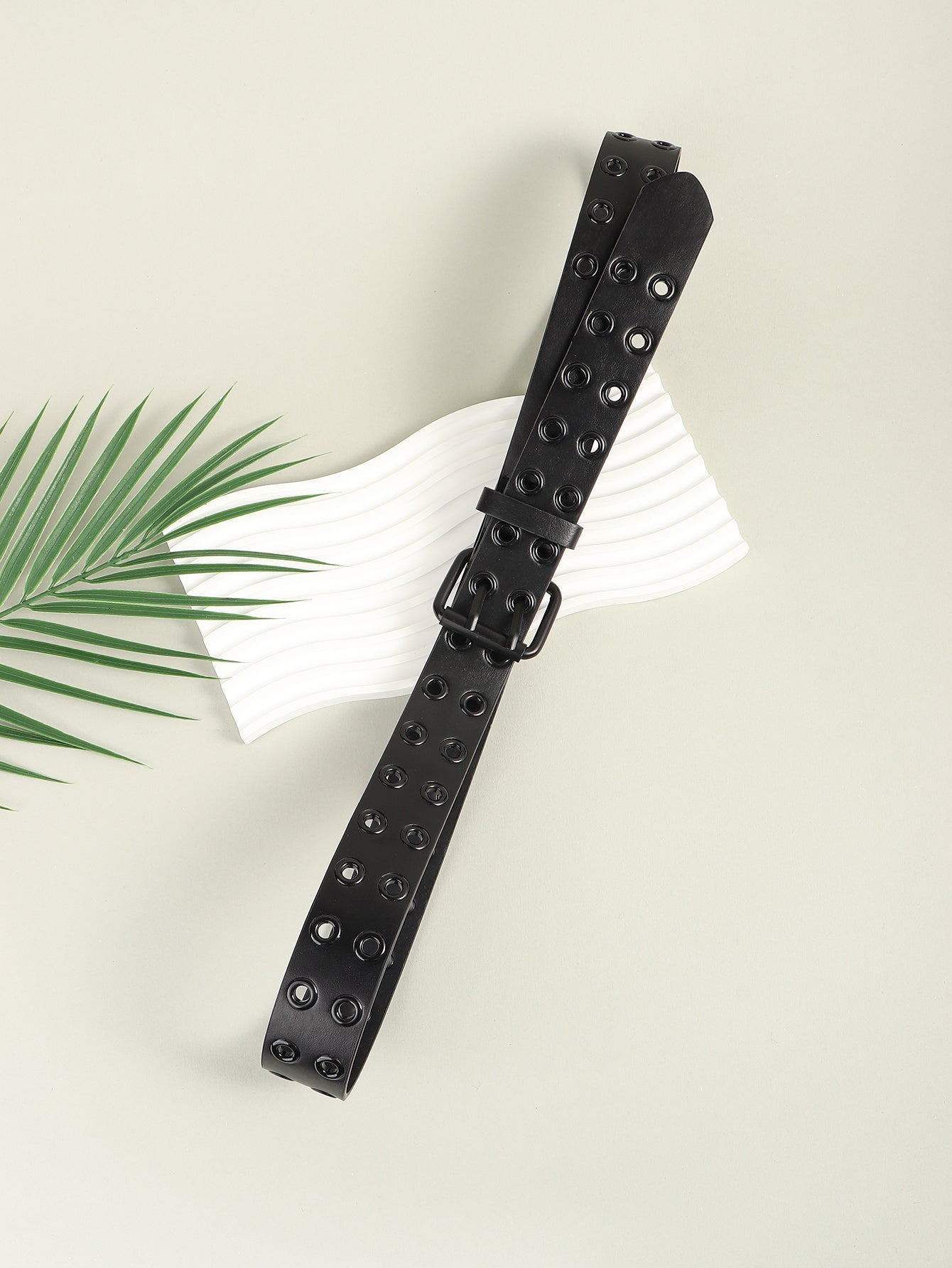 Black vegan leather grommet belt with square buckle, long strap shown