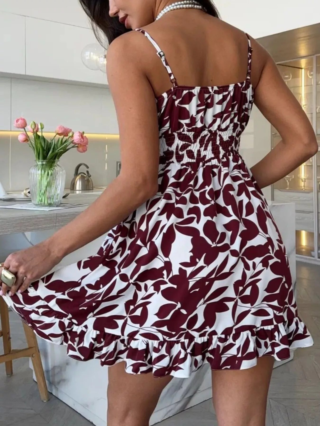 Burgundy mini dress with white abstract print, spaghetti straps, layered ruffle hem
