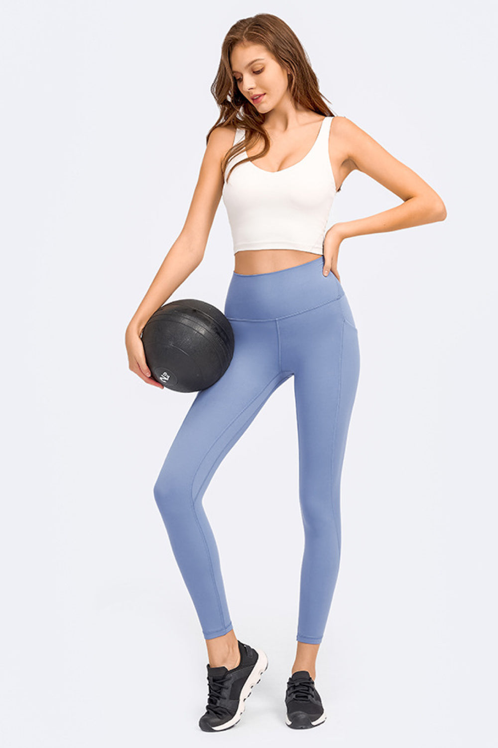 White deep V-neck crop sports bra with wide neckline