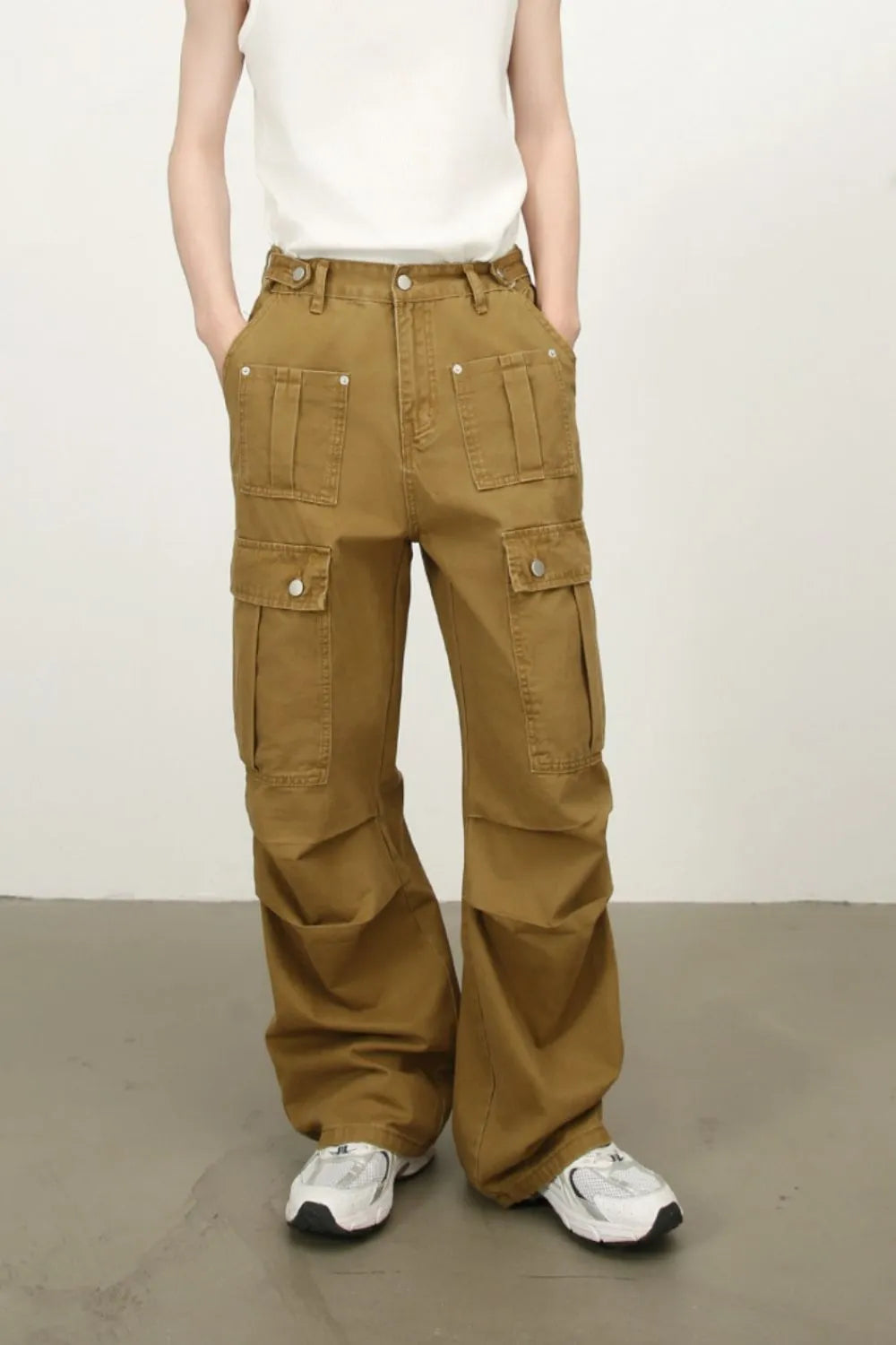 Khaki mid-rise cargo jeans with flap cargo pockets and wide leg