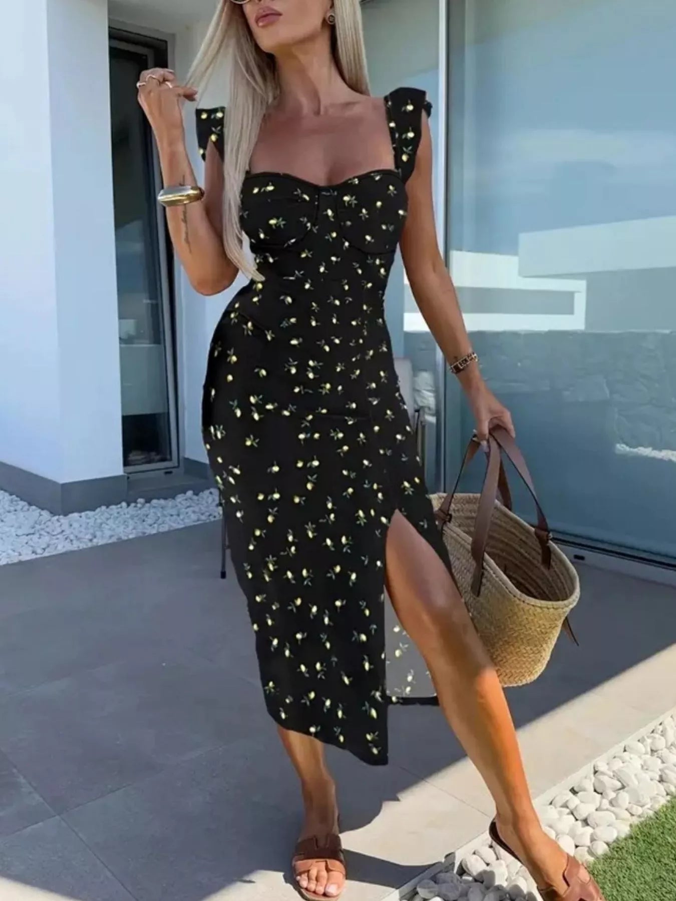 Black midi dress with gold sparkle pattern, sweetheart neckline, side slit