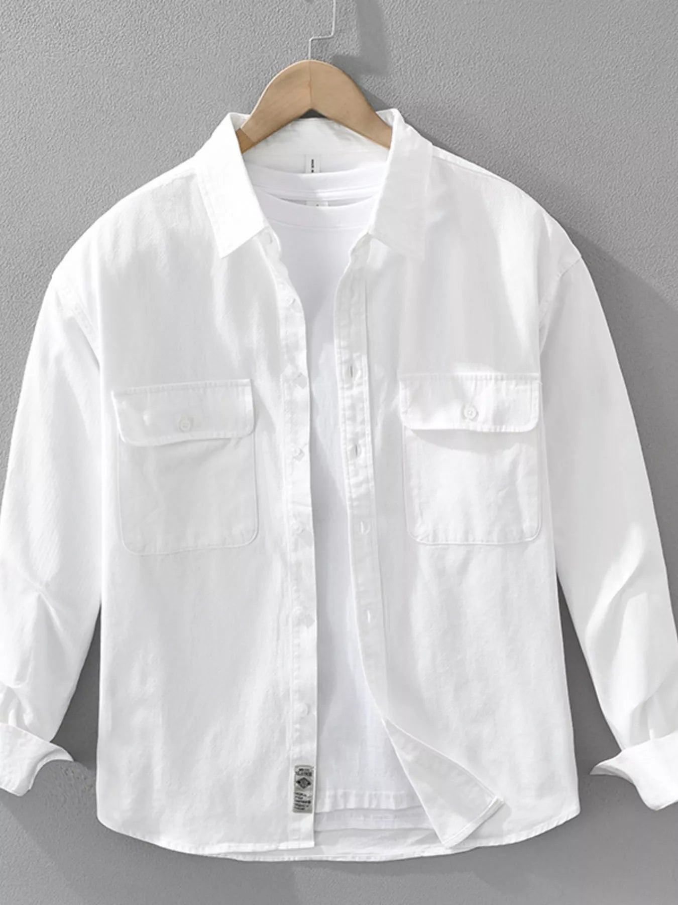 White plus size button-up long sleeve shirt with two chest pockets