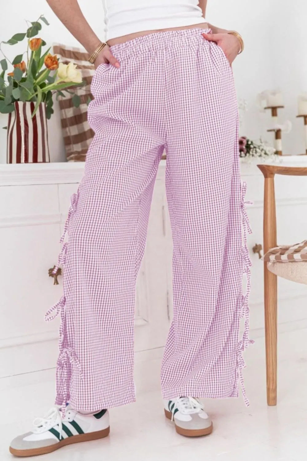 Pink gingham wide-leg pants with side ties and elastic waistband