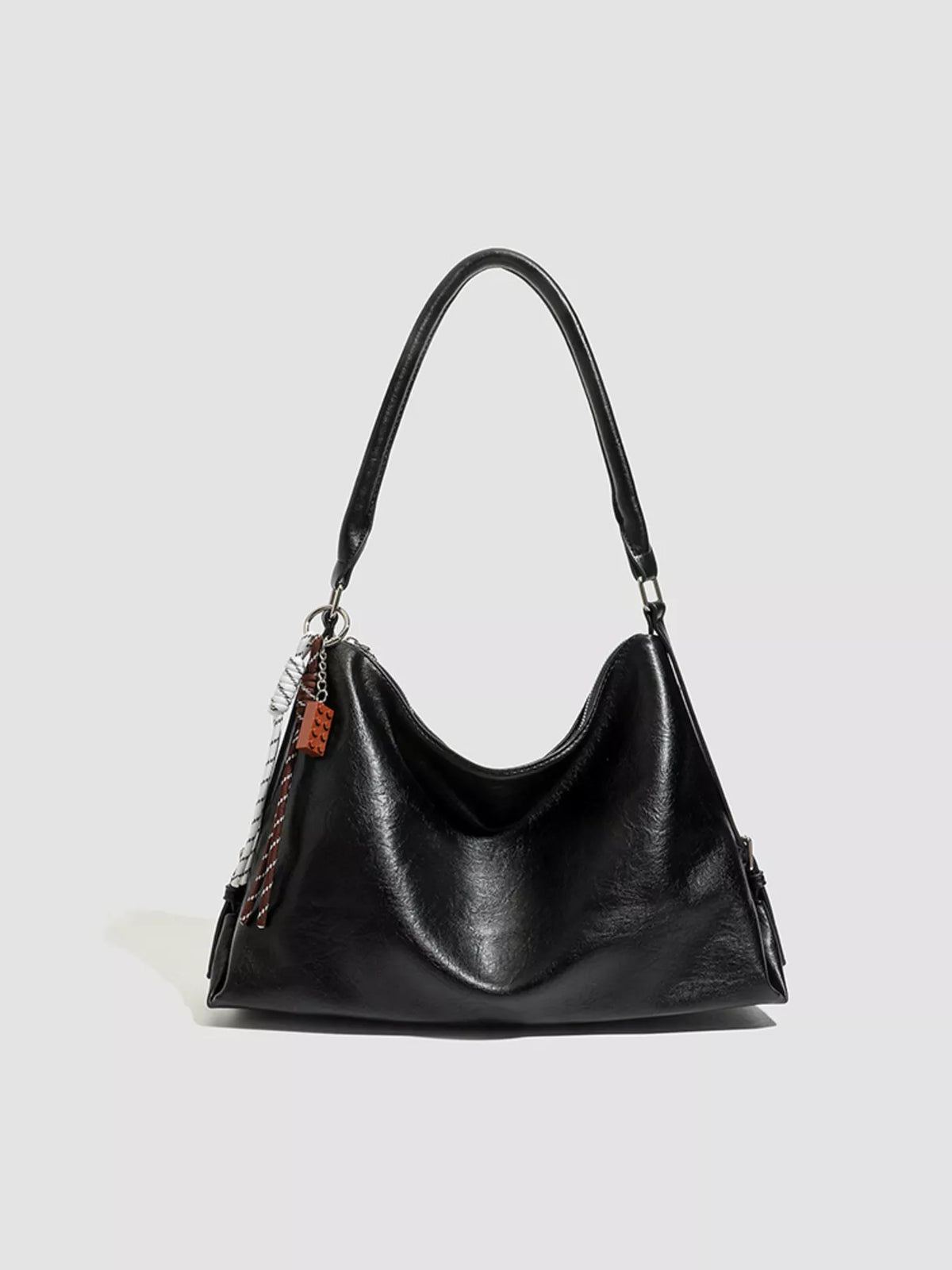Black vegan leather hobo shoulder bag with curved top handle and open top