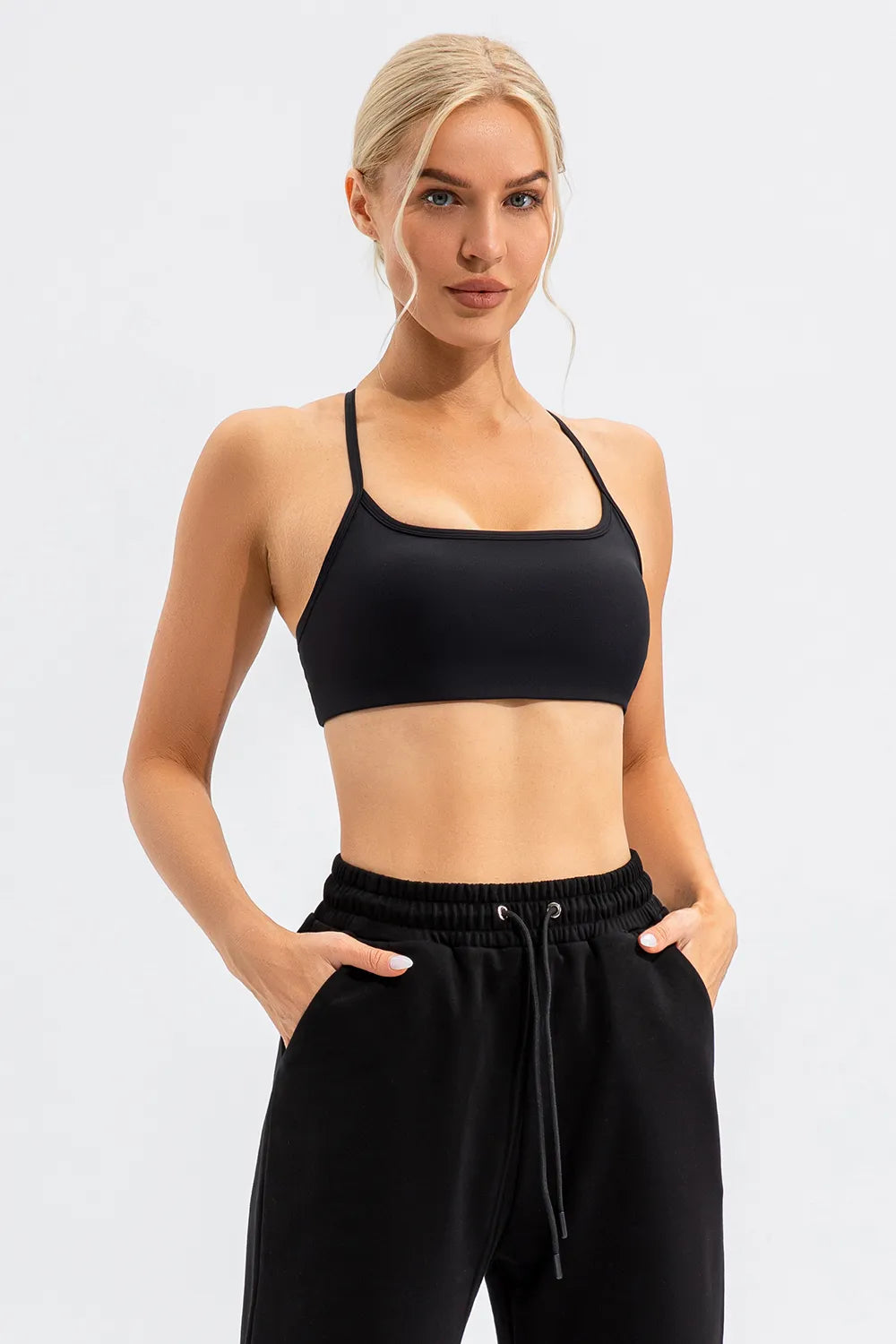 Crisscross spaghetti strap active cami, black with wide band hem