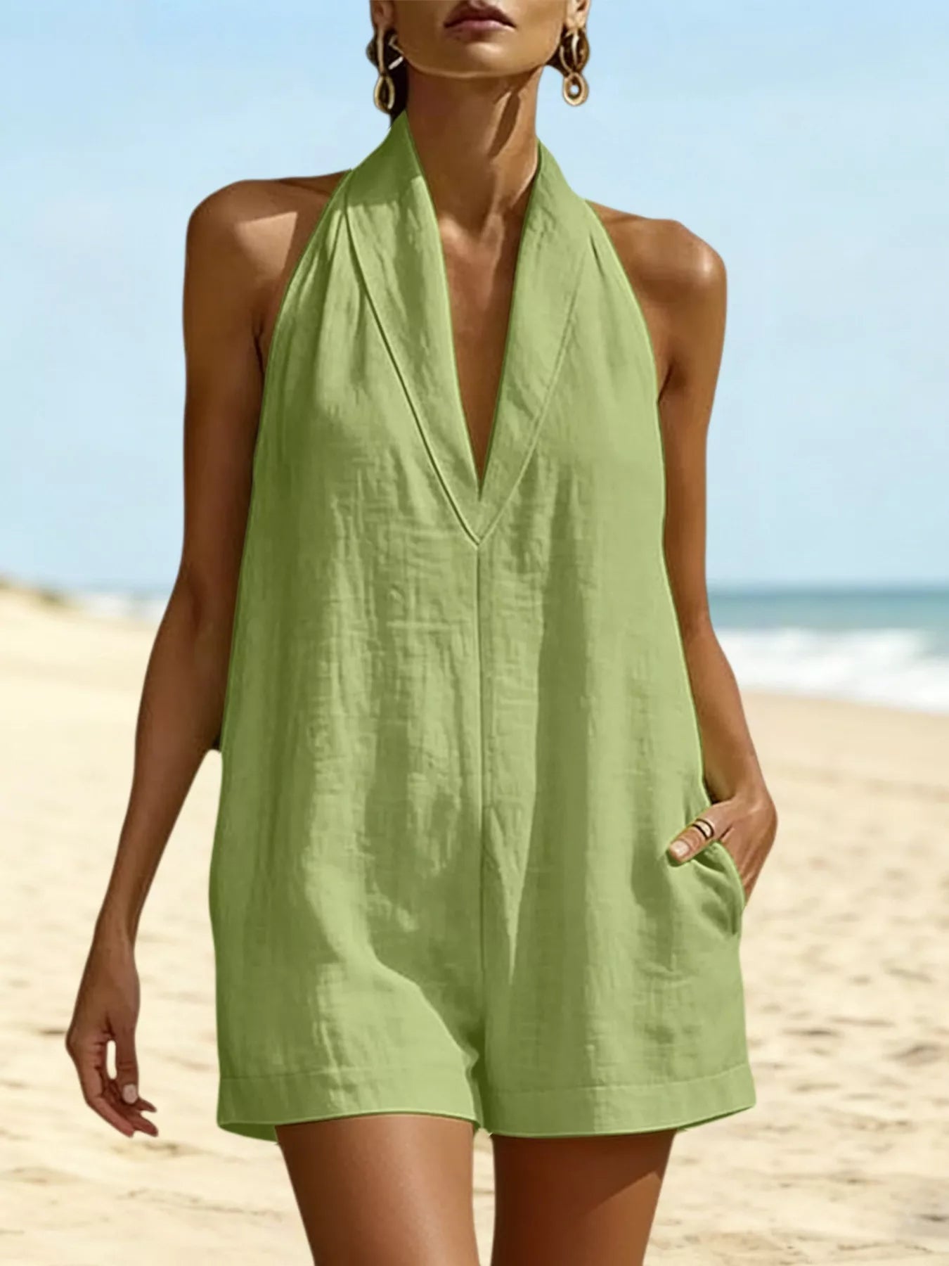 Light green halter neck romper with pockets, sleeveless front