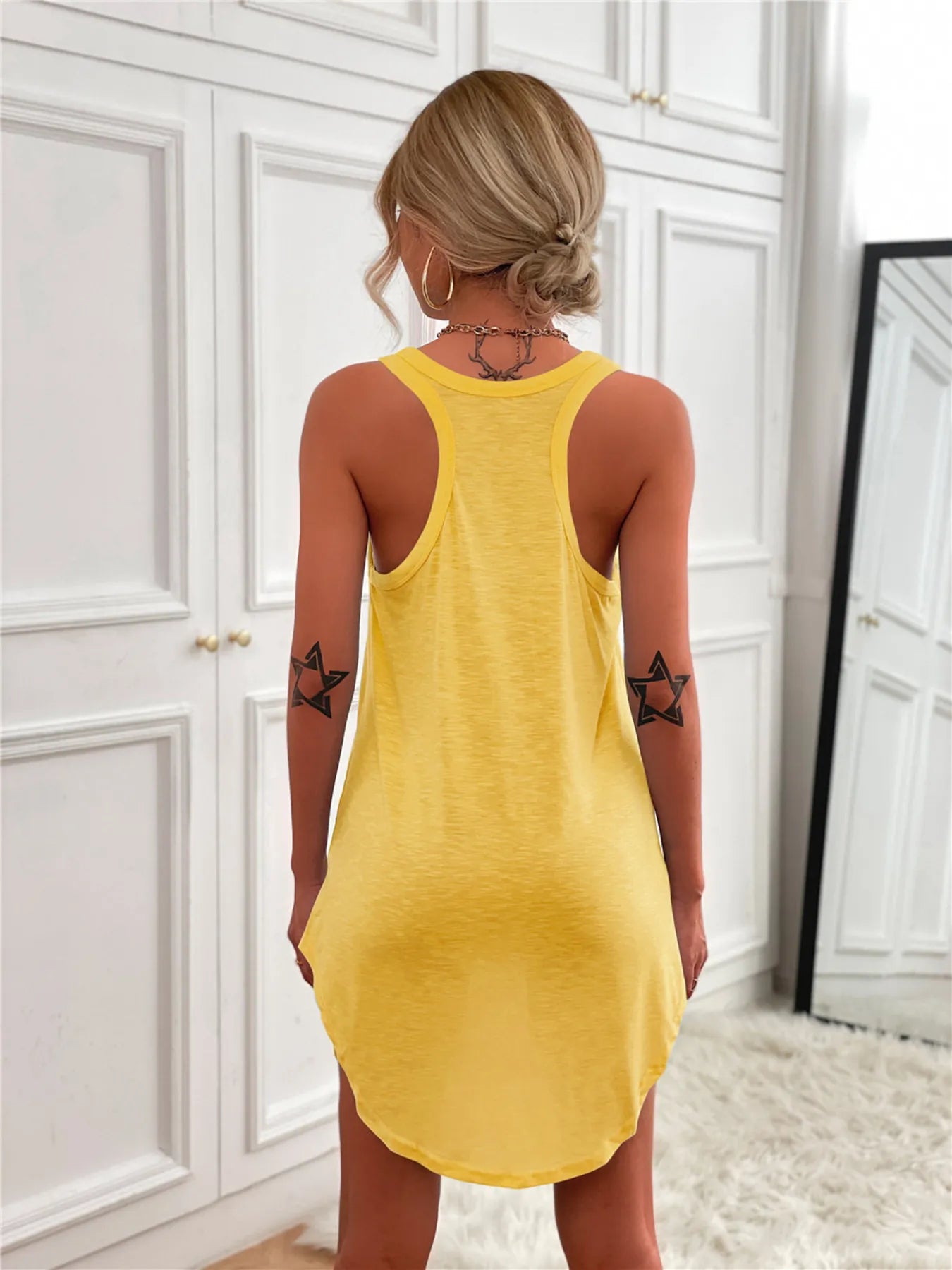 Casual yellow tank mini dress with curved hem and racerback