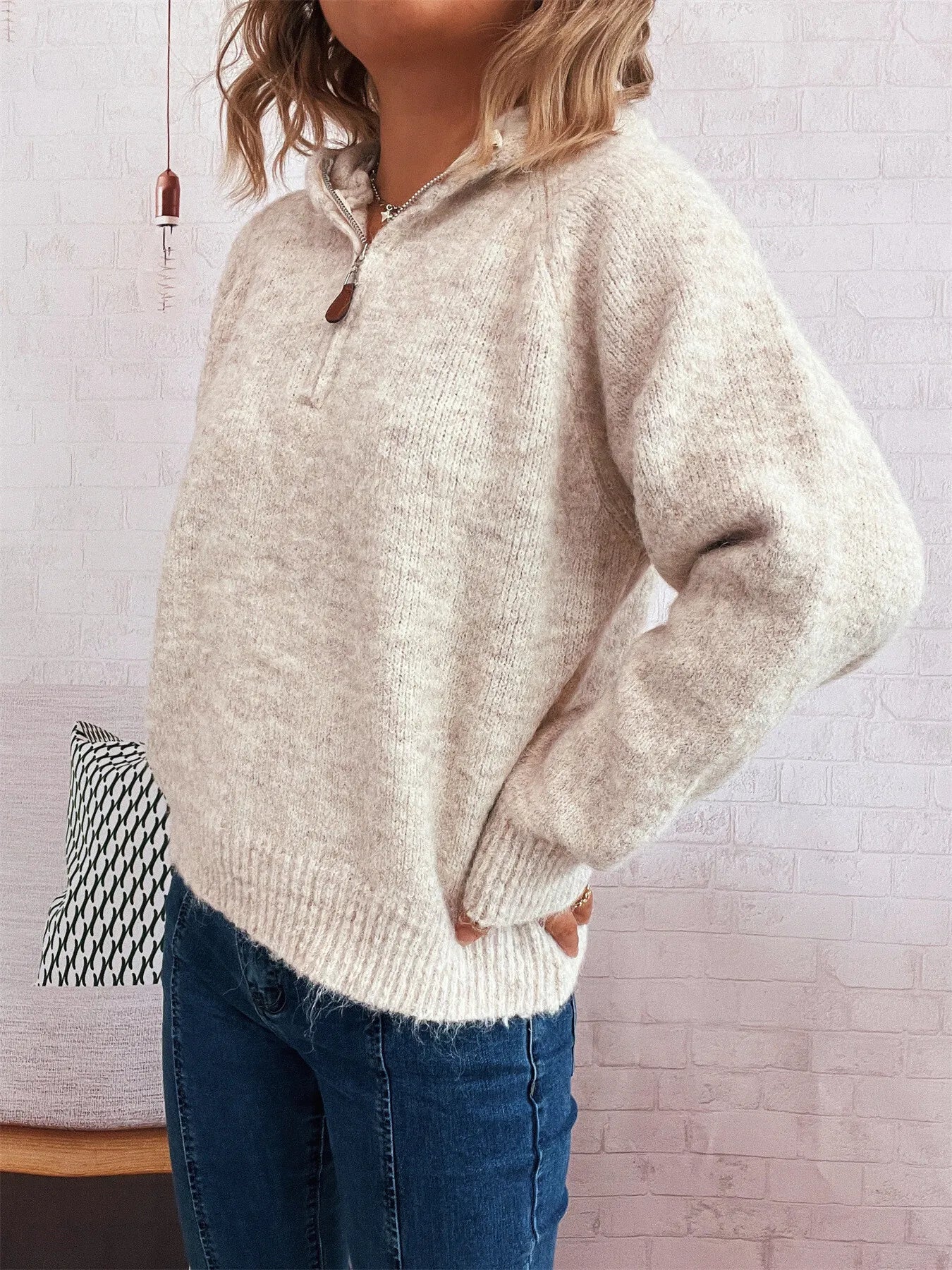 Light beige quarter-zip knit sweater with ribbed cuffs and hem