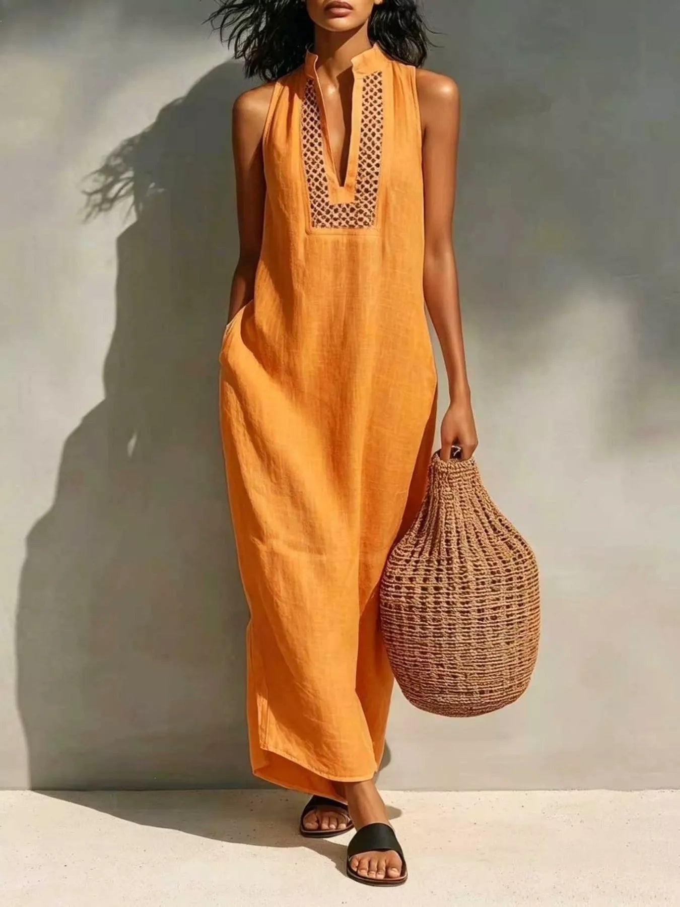 Orange sleeveless maxi dress with V-neck embroidery and side pockets