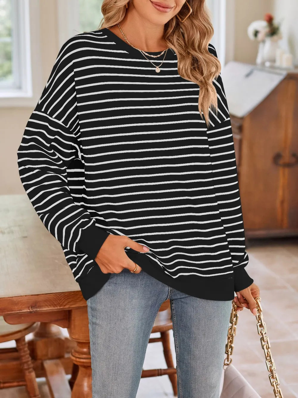 Black striped long-sleeve sweatshirt with crew neck and white horizontal lines