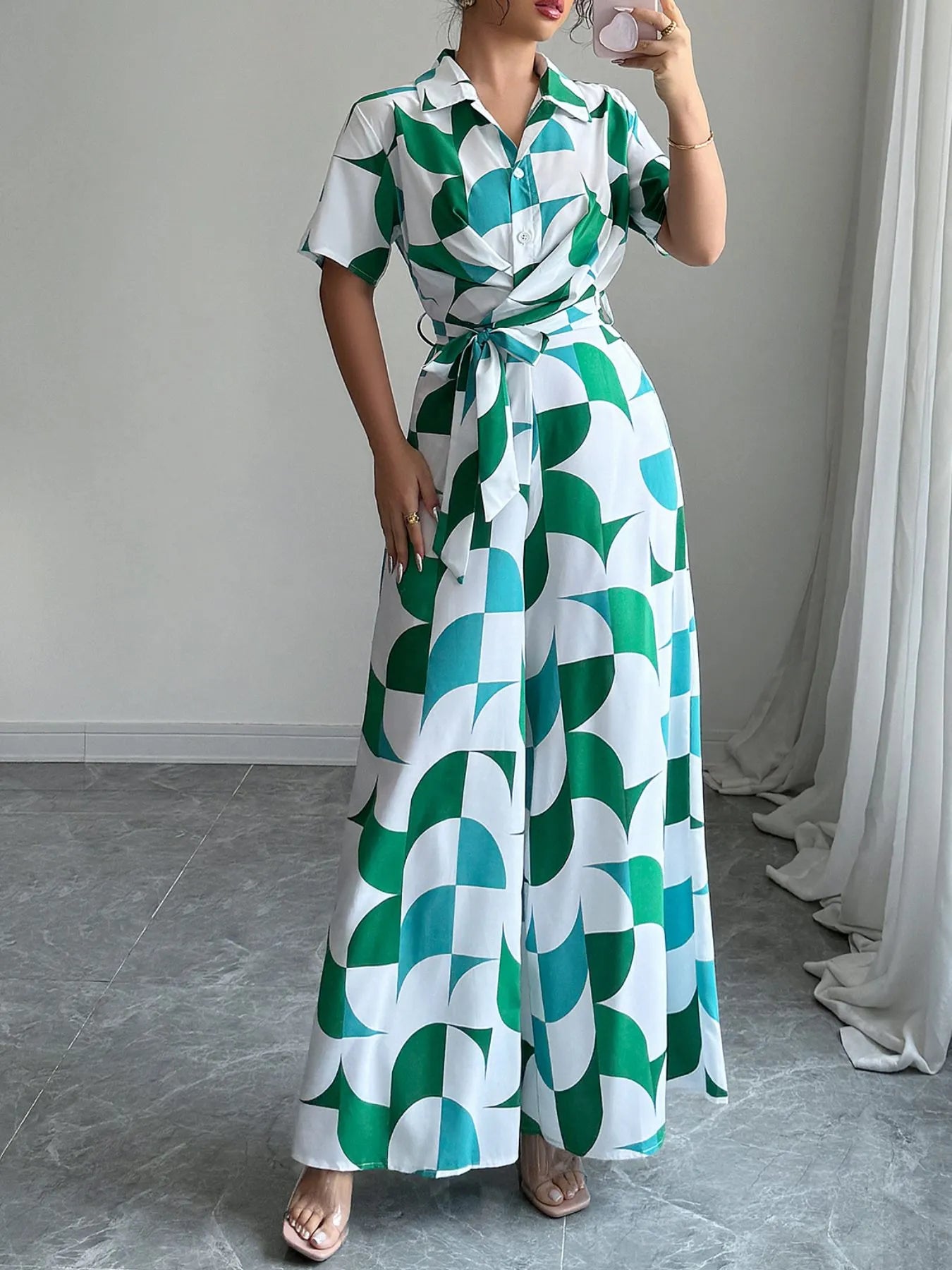 Green and turquoise geometric belted wide-leg jumpsuit with shirt collar and short sleeves