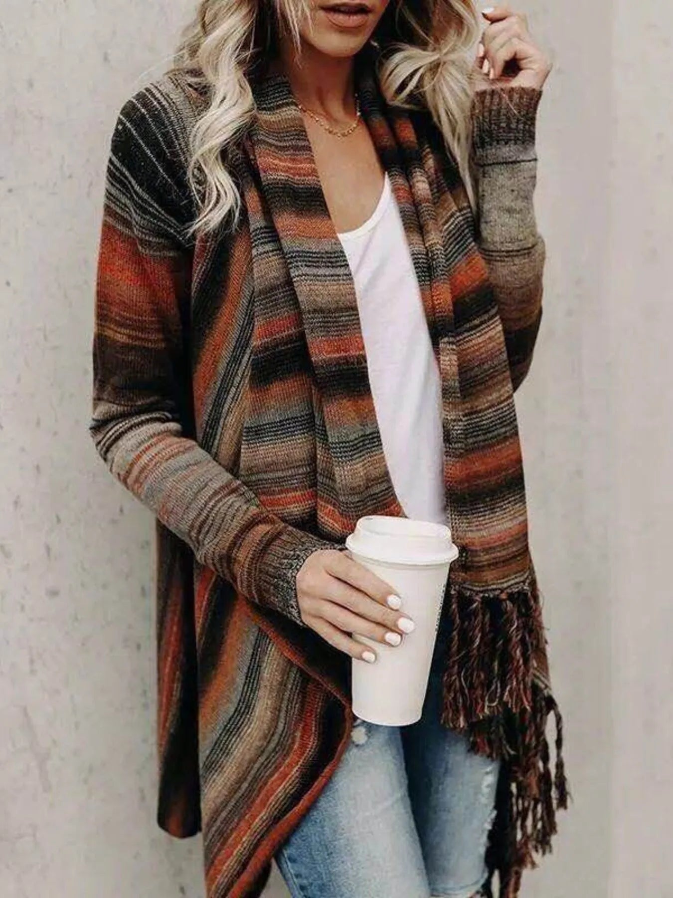 Orange and brown striped wrap cardigan with long sleeves and fringe hem