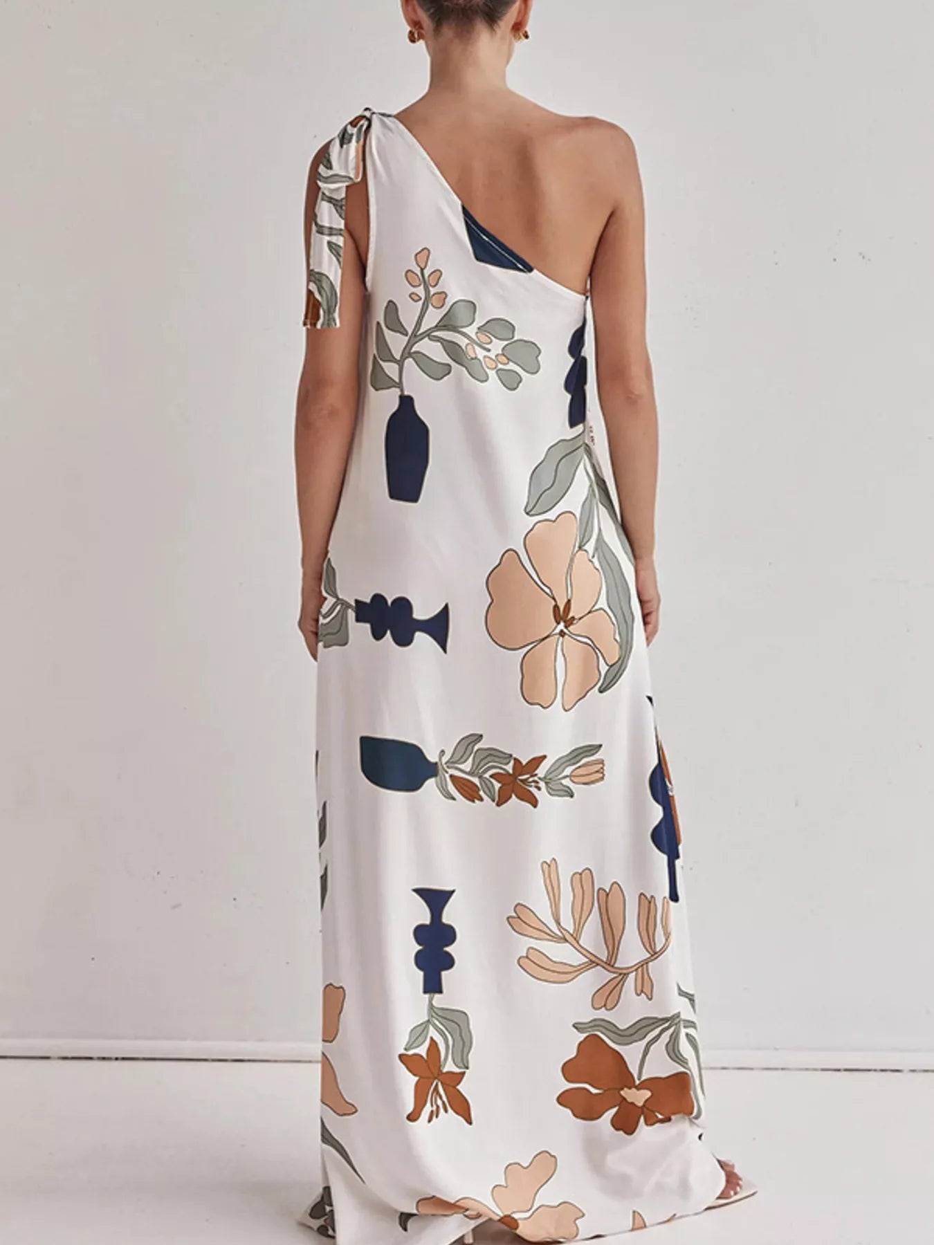 Cedar & Moore Bohemian floral print one-shoulder maxi dress in ivory with peach and navy prints, back view