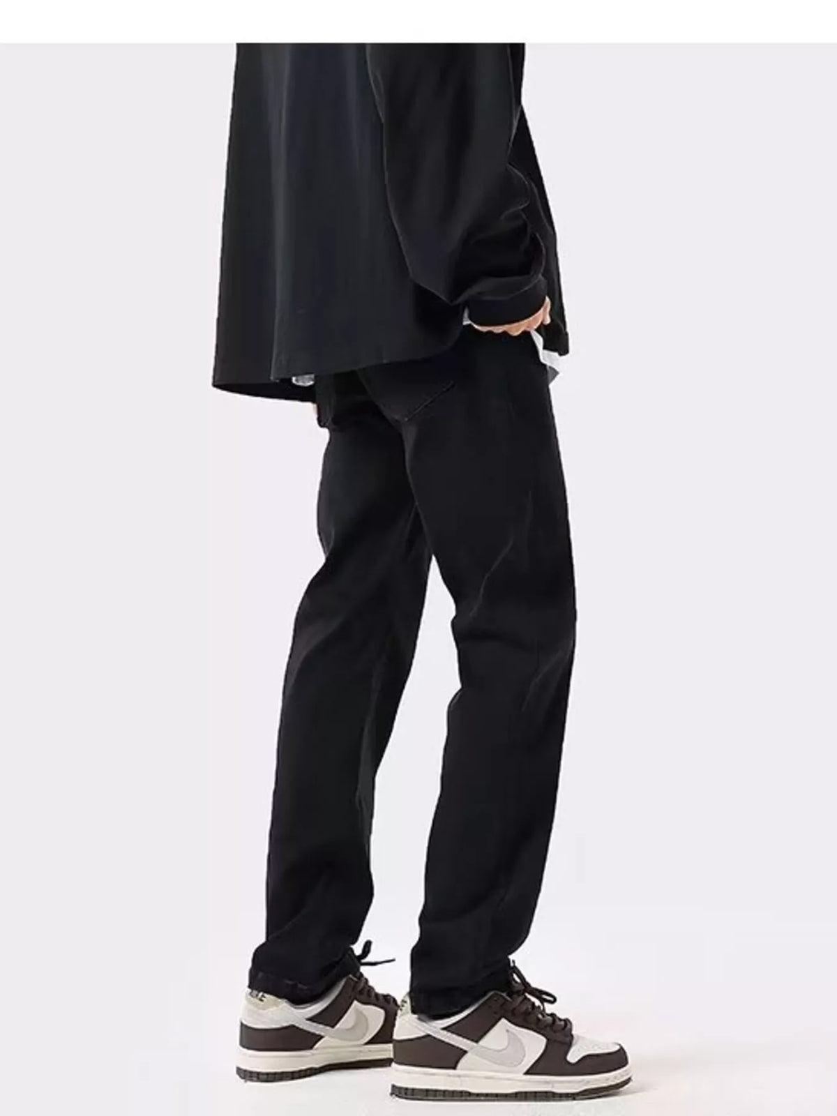 Black slim-fit cotton stretch jeans with straight tapered fit and cuffed ankle hem