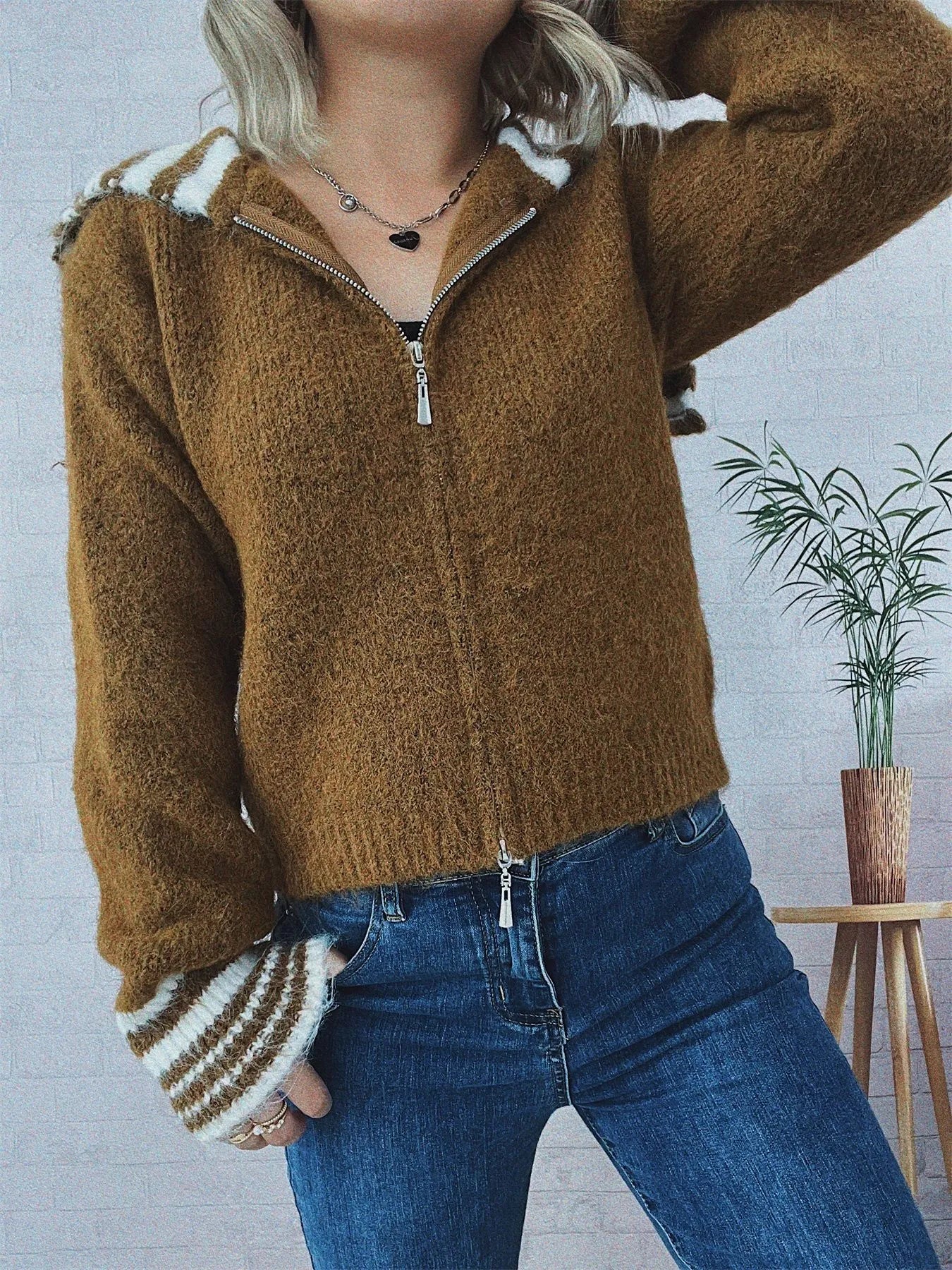 Brown zip-up cardigan with striped hood trim and ribbed striped cuffs, front zipper