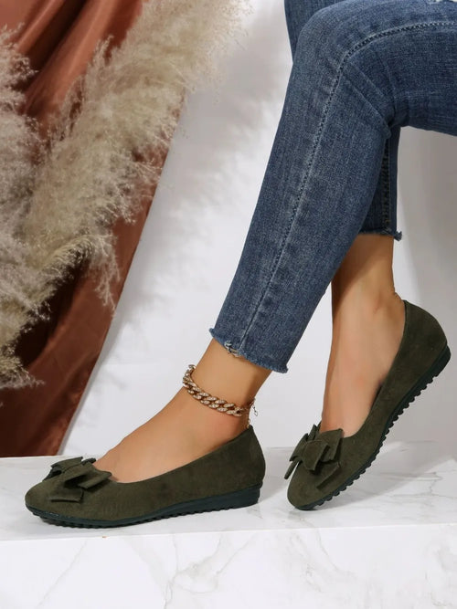 Moss green suede round-toe flat slip-on shoes with bow detail and treaded sole