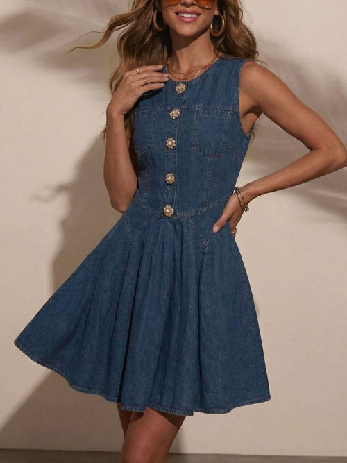 Sleeveless dark denim dress with button front and pleated skirt hem