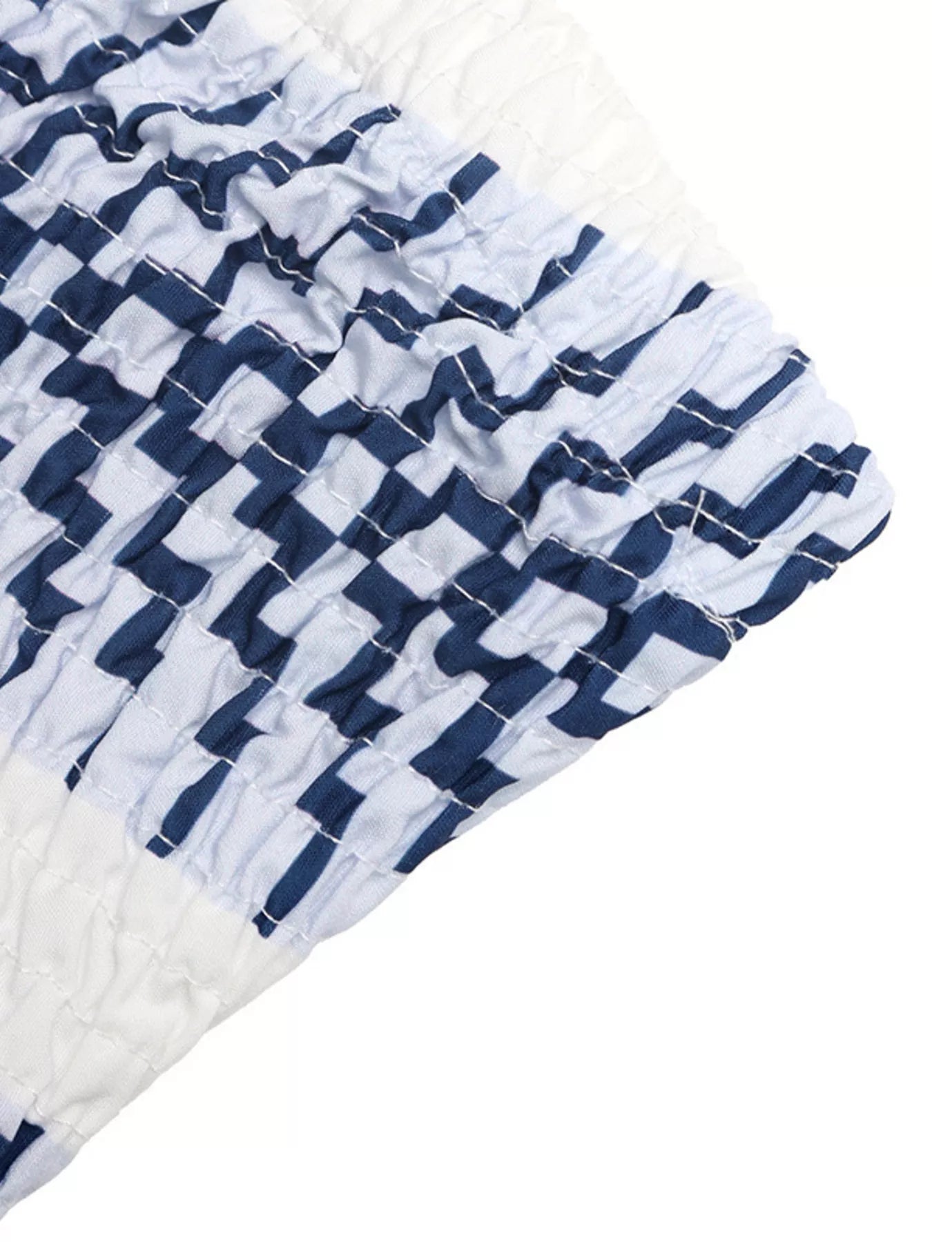Cedar & Moore Striped Print Strapless Jumpsuit fabric close-up in navy and white with smocked texture