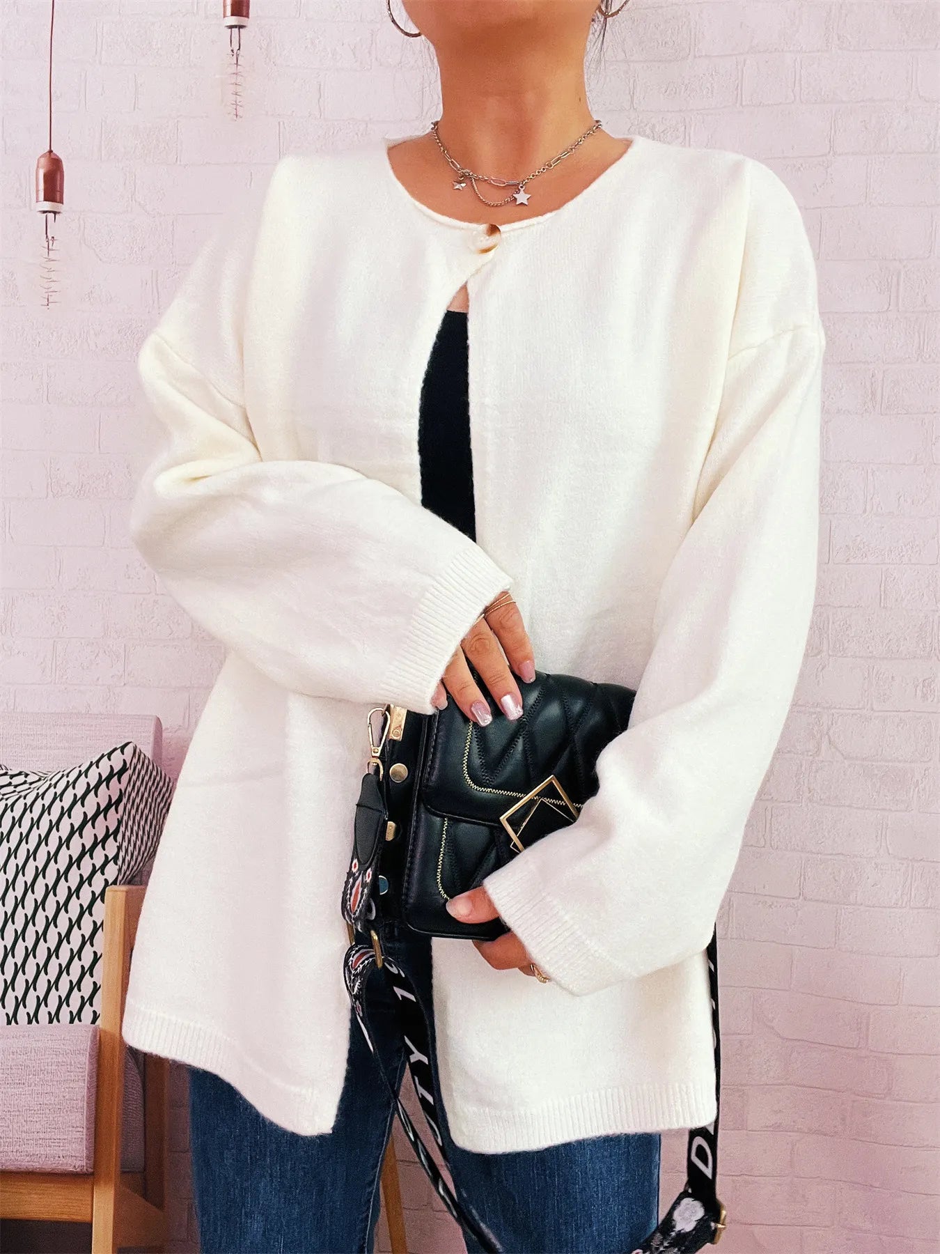 Cream one-button drop-shoulder cardigan with crew neck and long sleeves