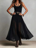 Black sleeveless scoop-neck maxi dress with flowy pleated skirt and wide belt