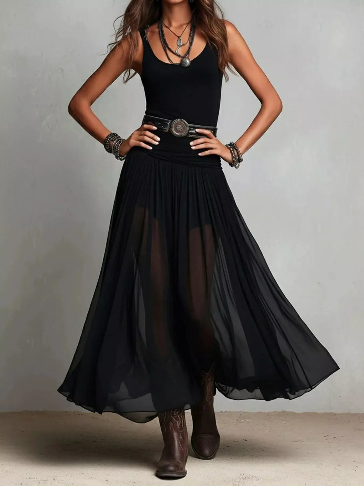 Black sleeveless scoop-neck maxi dress with flowy pleated skirt and wide belt