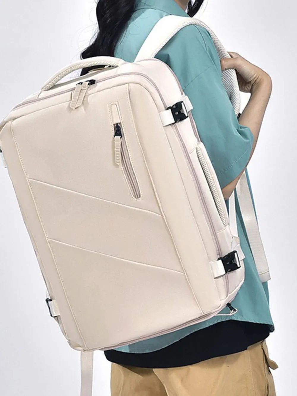 Beige canvas backpack bag with adjustable straps and front zip pocket