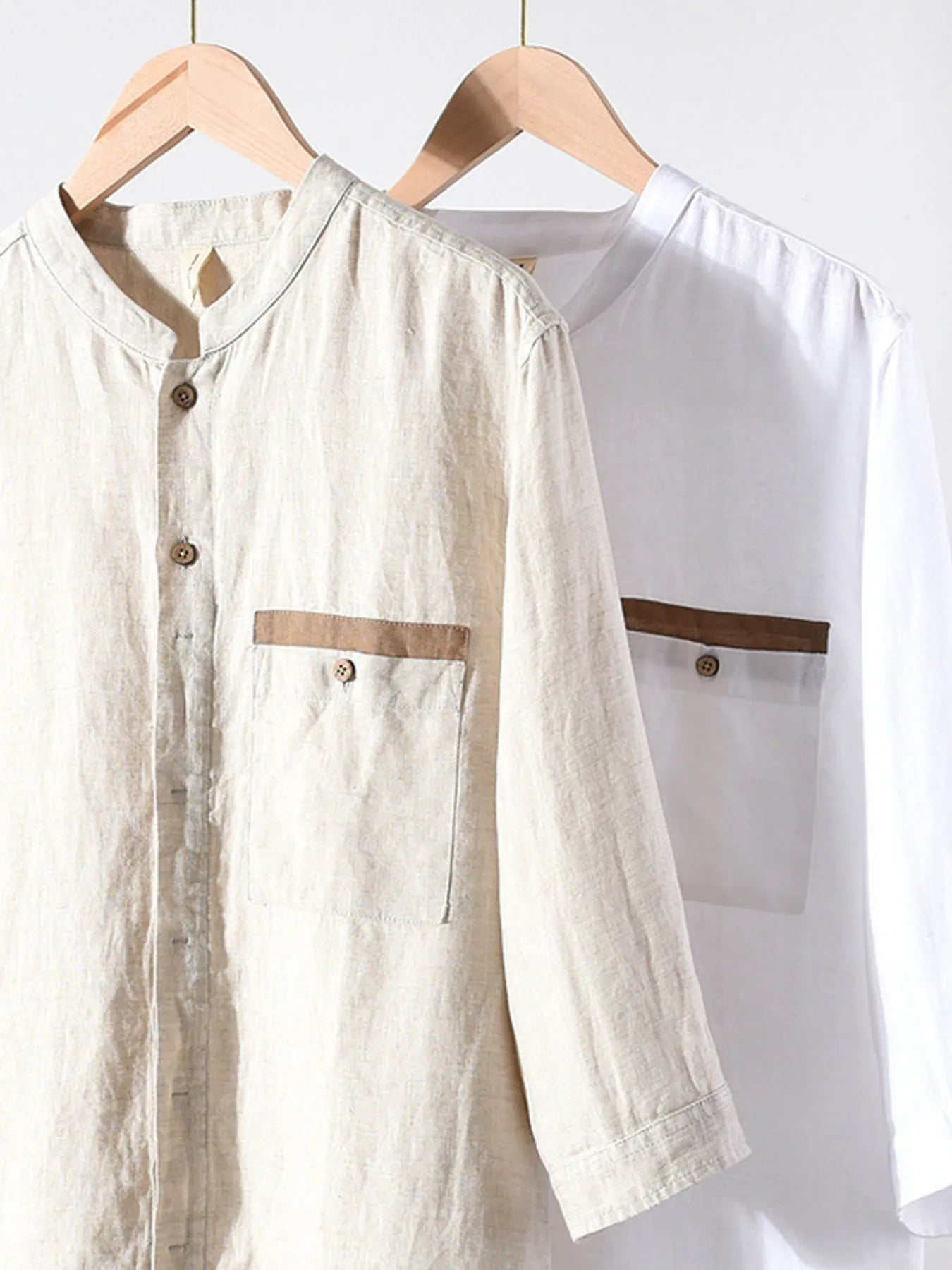 Light khaki and white button-up shirts, 3/4 sleeves, stand collar, button fronts