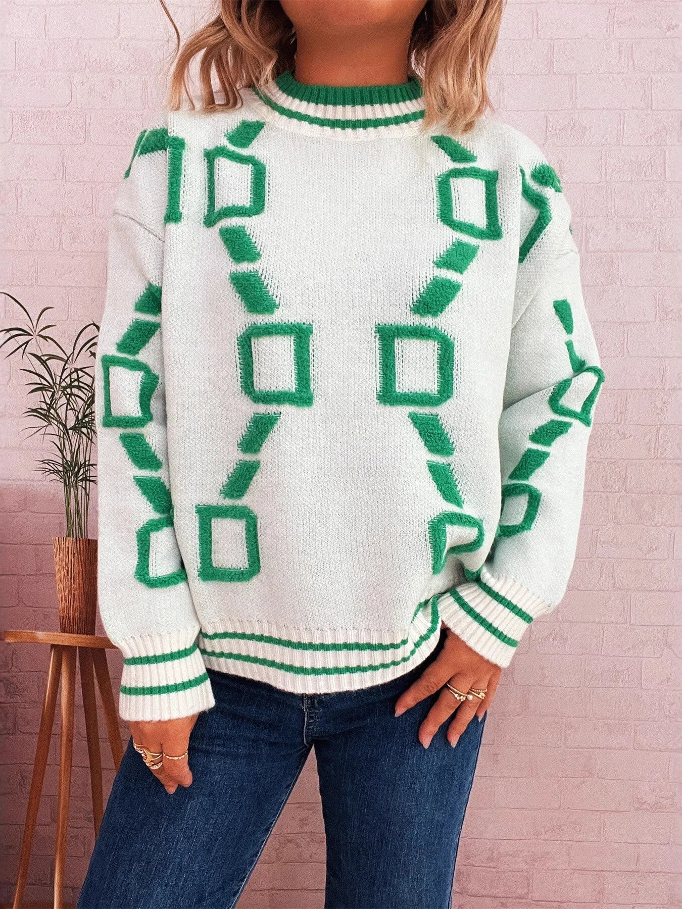 White contrast long-sleeve sweater with green geometric motif and ribbed cuffs