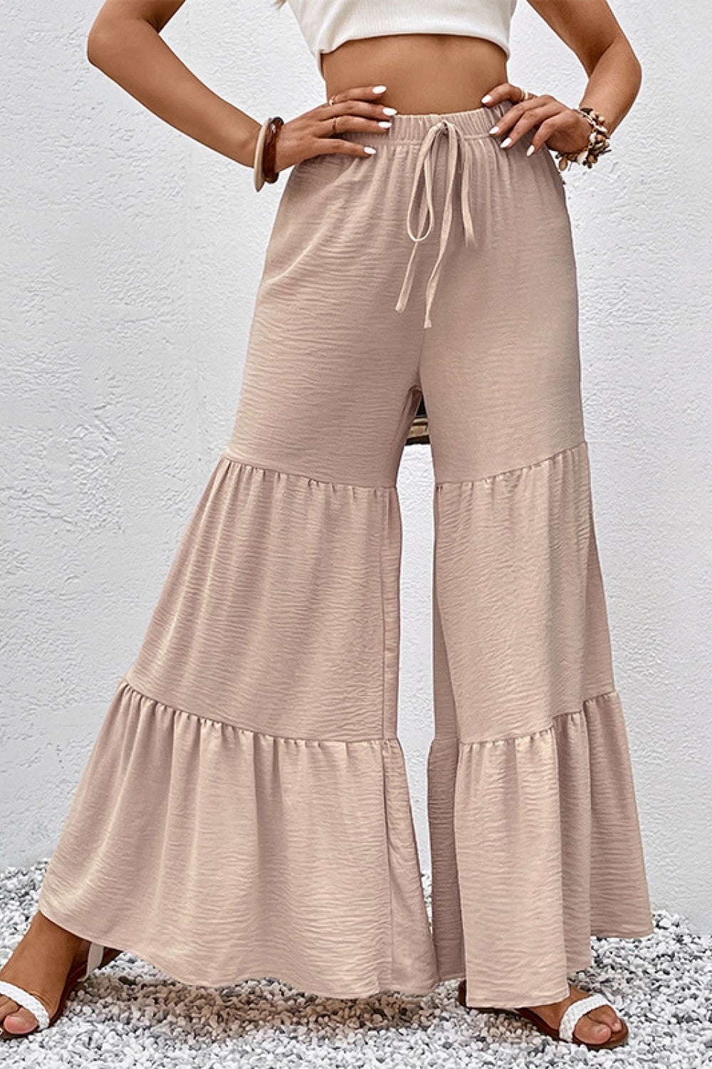 Tan tiered flare culottes with drawstring waist and flowing hem