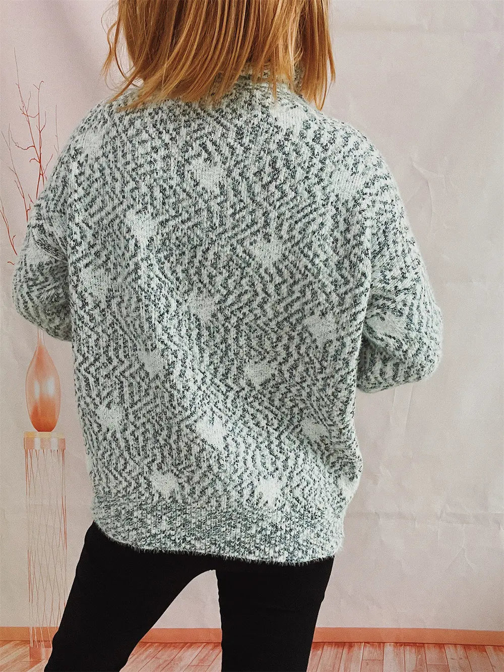 Heart-patterned heathered blue turtleneck drop-shoulder sweater, back view
