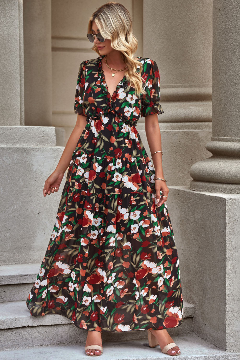 Floral V-neck short flounce sleeve dress with layered tiered skirt, black base.
