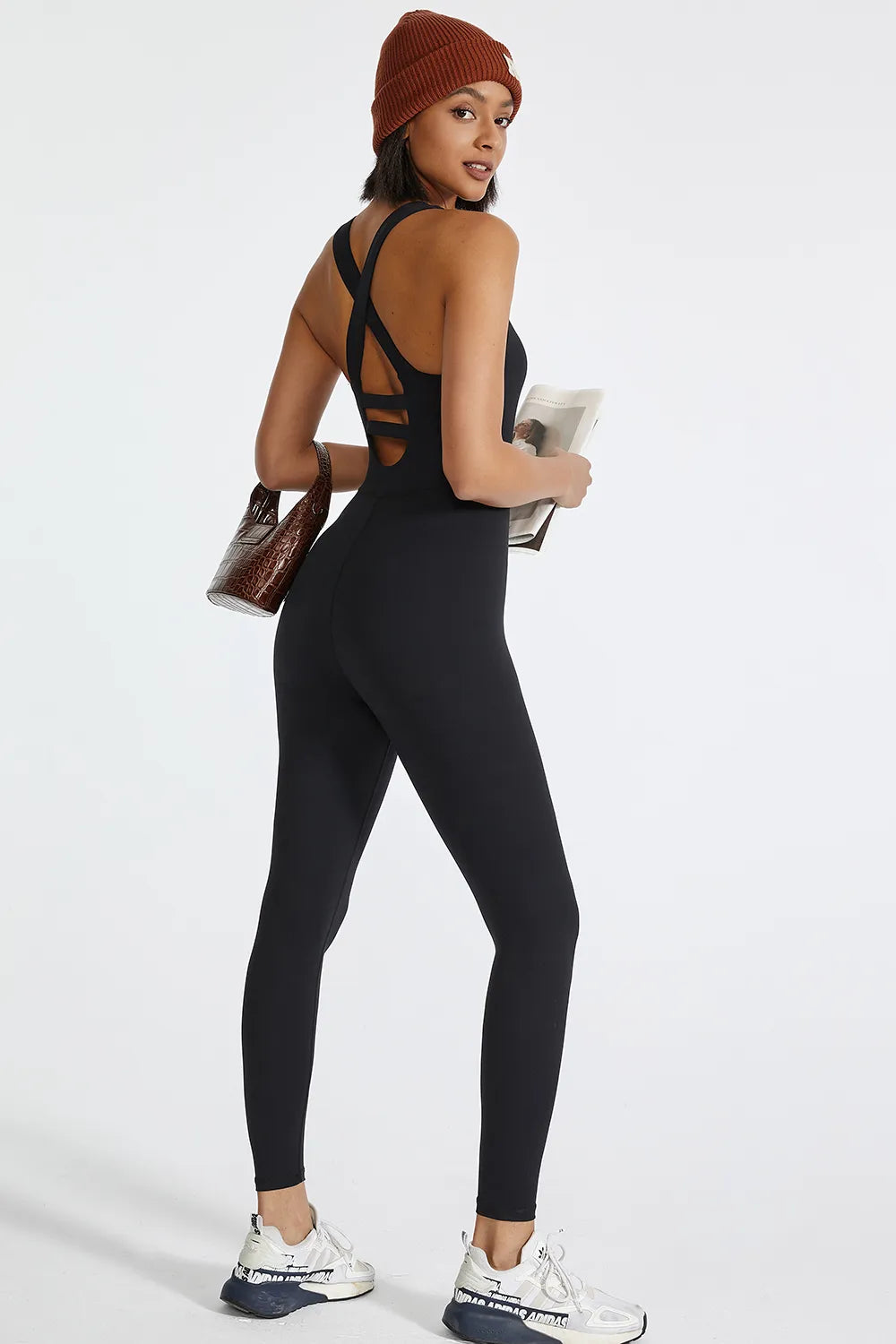 Black active jumpsuit with crisscross wide back straps and scoop back