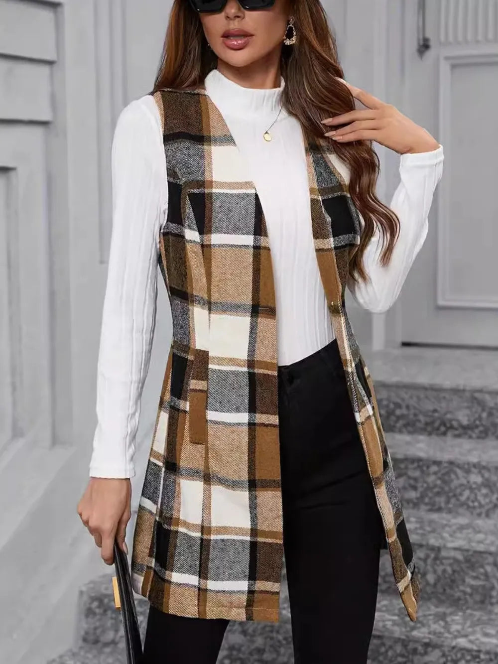 Plaid V-neck sleeveless vest coat in camel, black, and cream stripes
